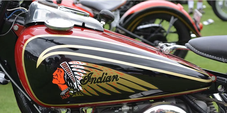 Photo of Indian head profile logo on Indian Motorcycle gas tank; Photo credit: Daniel Hartwig from San Mateo, CA, USA, CC BY 2.0, via Wikimedia Commons, cropped